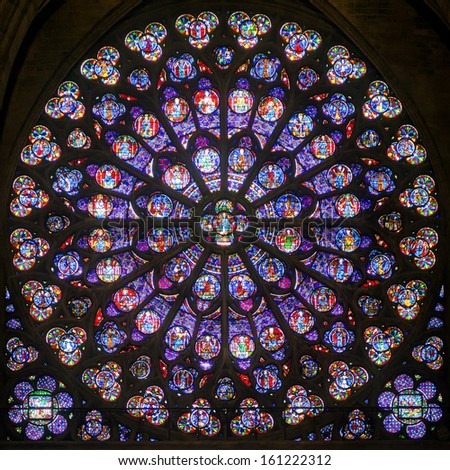 PARIS - SEPTEMBER 25: Rose stained glass window of Notre Dame Cathedral on september 25, 2013 in Paris. Notre Dame Cathedral was built in the 3rd century and is one of the main attractions of Paris.