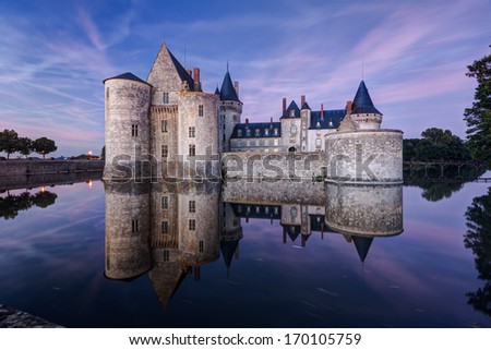 The chateau of Sully-sur-Loire at night, France. This castle is located in the Loire Valley, dates from the 14th century and is a prime example of medieval fortress.
