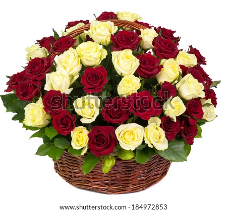 Natural red and yellow roses in a basket isolated on white background