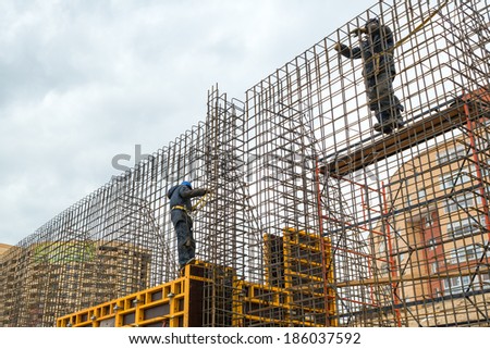 MOSCOW - APRIL 3: Construction site workers on april 3, 2014 in Moscow, Russia. Urban construction is at a faster pace in Russia.
