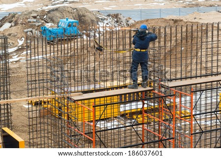 MOSCOW - APRIL 3: Construction site worker on april 3, 2014 in Moscow, Russia. Urban construction is at a faster pace in Russia.