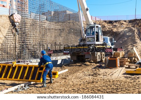 MOSCOW - MAR, 27: Construction site workers on march 27, 2014 in Moscow, Russia. Urban construction is at a faster pace in Russia.