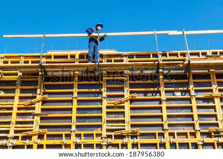 MOSCOW - APRIL 17: Construction site worker on april 17, 2014 in Moscow, Russia. Urban construction is at a faster pace in Russia.