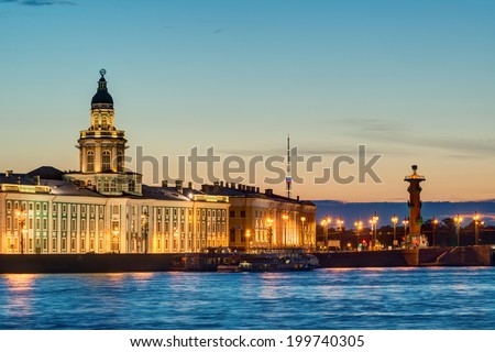 Night view of the Neva embankment Kunstkamera and Rostral column. St. Petersburg, Russia.