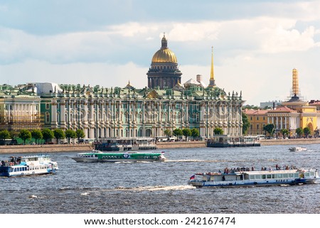 ST PETERSBURG, RUSSIA - JUNE 13, 2014: Tourist boats floating on the Neva River. St. Petersburg was the capital of Russia and attracts many tourists.