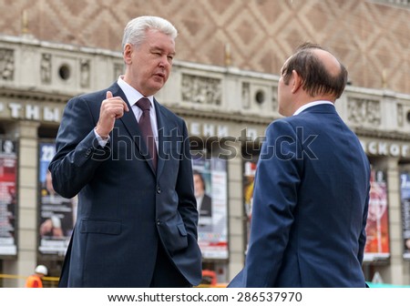 MOSCOW - JUNE 11, 2015: Moscow Mayor S. Sobyanin talks with his deputy on the Triumph Square. This is one of the central squares of Moscow, which conducted large-scale reconstruction.