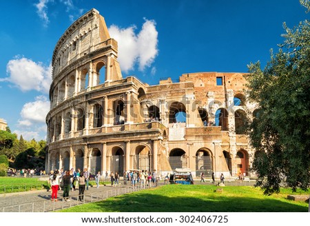 ROME - OCTOBER 4, 2012: Tourists visiting the Colosseum (Coliseum). The Colosseum is a major tourist attraction in Rome.