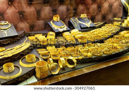 ISTANBUL - MAY 27, 2013: Oriental gold jewelry sold in the Grand Bazaar. The Grand Bazaar is the oldest and the largest covered market in the world, with 61 covered streets.
