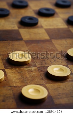 Color shot of a vintage draughts or checkers board game.