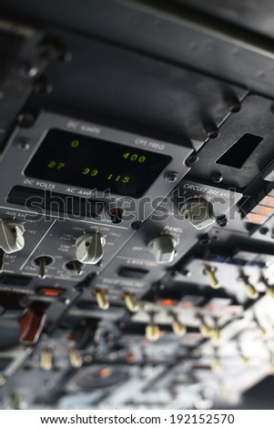 The pilots\' control panel inside a passenger airplane.
