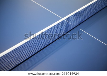 Color detail of a net on a ping-pong table.