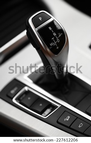 Detail on a automatic gear shifter in a new car.