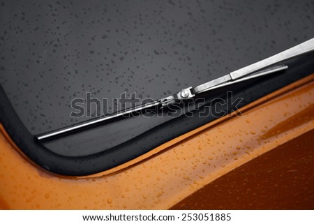 Color horizontal shot of a vintage car screen wiper.