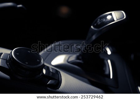 Detail of some black buttons in a car.