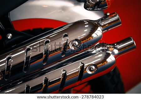 Color image of a motorcycle exhaust pipe.