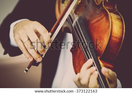 Detail of viola being played by a musician