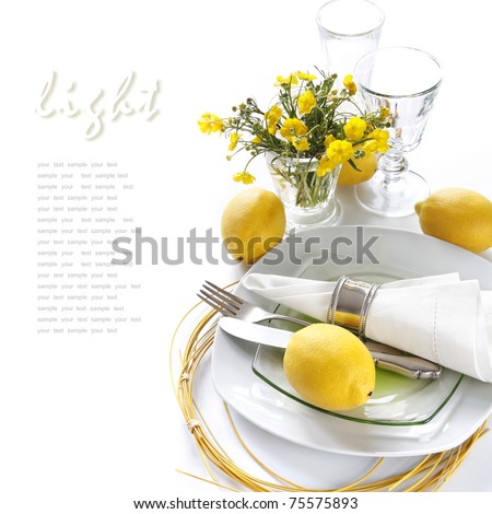 stock photo Table setting in white and yellow tones