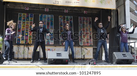 NEW YORK - APRIL 28: Cast of Broadway musical Rock of Ages performs on stage at Family festival during the 2012 Tribeca Film festival on Greenwich street on April 28, 2012 in New York City