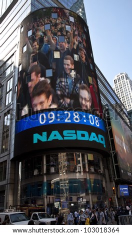 NEW YORK - MAY 18: Image of employees of Facebook is flashed on a screen outside the NASDAQ stock exchange at the opening bell in Times Square on May 18, 2012 in New York City.
