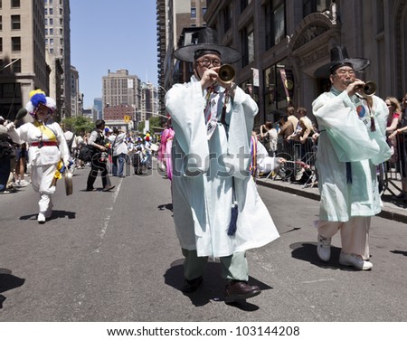 NEW YORK - MAY 19: Members of Korean Music and Dance Institute perform on Broadway as part of New York Dance Parade on May 19, 2012 in New York City