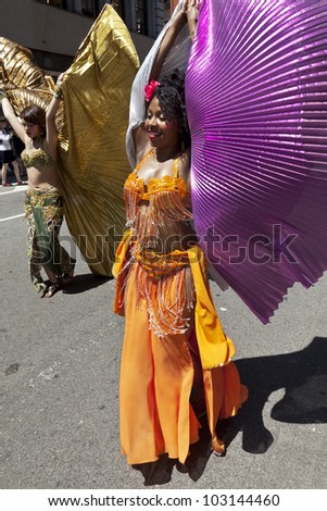 NEW YORK - MAY 19: Members of Andrea Belly dance group perform on Broadway as part of New York Dance Parade on May 19, 2012 in New York City