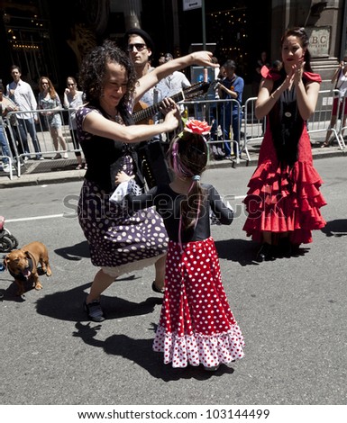 NEW YORK - MAY 19: Members of Xianix Barrera dance group perform Flamenco dance on Broadway as part of New York Dance Parade on May 19, 2012 in New York City