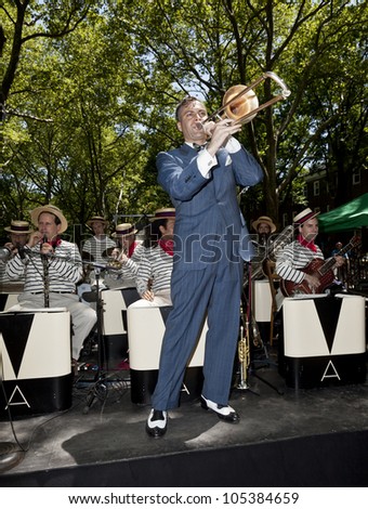 NEW YORK - JUNE 16: Michael Arenella musician, singer and band leader and his Dreamland orchestra at 7th Annual Jazz age concert and picnic on Governors Island on June 16 2012 in New York