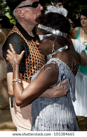 NEW YORK - JUNE 16: unidentfied couple dances at 7th Annual Jazz age concert and picnic on Governors Island on June 16 2012 in New York