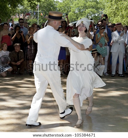 NEW YORK - JUNE 16: Roddy Caravella and wife dance at 7th Annual Jazz age concert and picnic on Governors Island on June 16 2012 in New York