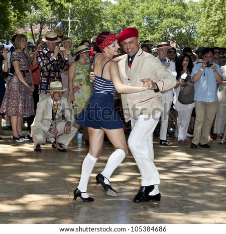 NEW YORK - JUNE 16: Jen Zakrzewski and ROddy Caravella dance at 7th Annual Jazz age concert and picnic on Governors Island on June 16 2012 in New York