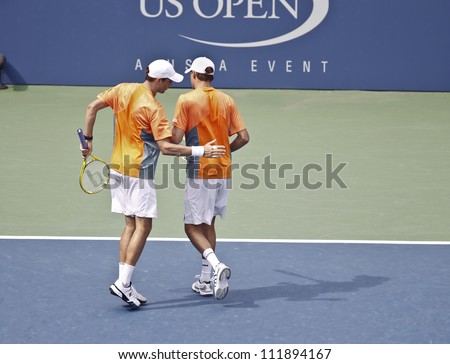 NEW YORK - SEPTEMBER 3: Bob & Mike Bryan of USA react during 3rd round men doubles match against Santiago Gonzalez of Mexico & Scott Lipsky of USA at US Open tennis tournament on Sep 3, 2012 in NYC