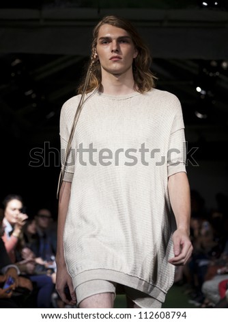 NEW YORK - SEPTEMBER 11: Model walks the runway for Lars Andersson Collection during Spring/Summer 2013 at Mercedes-Benz Fashion Week in Grand Soho Yard on September 11, 2012 in New York