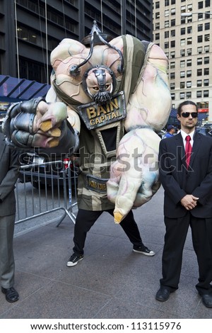 NEW YORK - SEPTEMBER 17: Mascot of Bain Capital made by protesters with \'Occupy Wall Street\' movement mark one year anniversary of protest in Zuccotti Park on September 17, 2011 in New York.