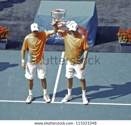 NEW YORK - SEPTEMBER 07: Bob & Mike Bryan of USA with winner trophy for men double at US Open tennis tournament on September 7, 2012 in New York City