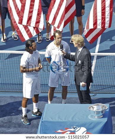 NEW YORK - SEPTEMBER 07: Leander Paes of India & Radek Stepanek of Czech Republic give interview at trophy presentation for men double final at US Open tennis tournament on September 7, 2012 in NYC