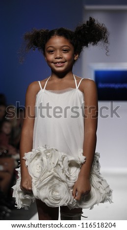 NEW YORK - OCTOBER 21: Girl walks runway for petite Parade show by Bonnie Young during kids fashion week sponsored by Vogue Bambini at Industria Supertudio on October 21, 2012 in New York City