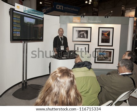 NEW YORK - OCTOBER 25: Photographer Jason Odell conducts seminar NIK software booth at Photoplus exhibition organized by Photo District News at Javits Convention Center on Oct 25 2012 in New York City