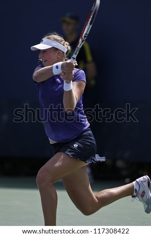 NEW YORK - AUGUST 28: Ekaterina Makarova of Russia returns ball during 1st round match against Eleni Danilidou of Greece at US Open tennis tournament on August 28, 2012 in Flushing Meadows New York