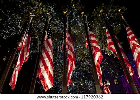 NEW YORK - NOVEMBER 06: American flags illuminated on 2012 Election day Presidential election on Rockefeller plaza on democracy Plaza sponsored by Microsoft on November 06, 2012 in NYC