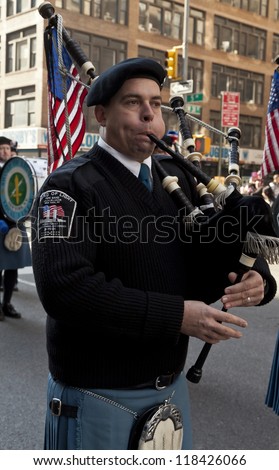 NEW YORK - NOVEMBER 11: Local 3 IBEW union pipe band walk at Veteran\'s Day Parade along 5th Avenue on November 11, 2012 in New York City