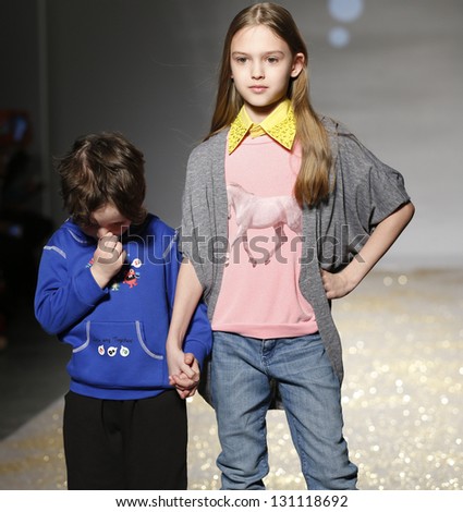 NEW YORK - MARCH 10: Boy & girl models walk runway for petite Parade show by Snopea during kids fashion week sponsored by Vogue Bambini at Industria Superstudio on March 10, 2013 in New York City