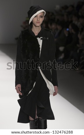 NEW YORK - FEBRUARY 07: Model walks runway at Fall 2013 show for Concept Korea collection by Choiboko at Mercedes-Benz Fashion Week at Lincoln Center on February 07, 2013 in New York