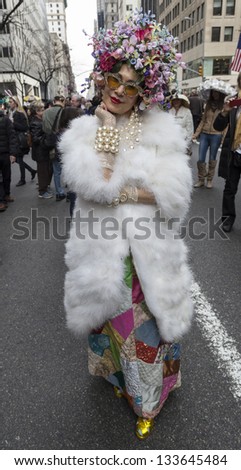 NEW YORK - MARCH 31: Unidentified woman partakes and shows off their hats at the Easter Bonnet Parade on 5th Avenue on March 31, 2013 in New York City.