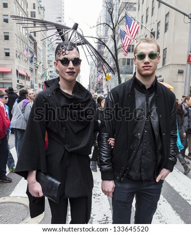 NEW YORK - MARCH 31: Unidentified couple partakes and shows off their hats at the Easter Bonnet Parade on 5th Avenue on March 31, 2013 in New York City.