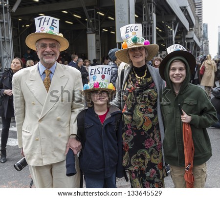 NEW YORK - MARCH 31: Unidentified family partakes and shows off their hats at the Easter Bonnet Parade on 5th Avenue on March 31, 2013 in New York City.