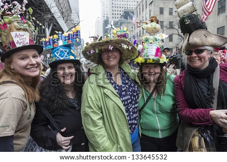 NEW YORK - MARCH 31: Unidentified women partake and show off their hats at the Easter Bonnet Parade on 5th Avenue celebrating all kind of holidays on March 31, 2013 in New York City.