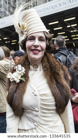NEW YORK - MARCH 31: Unidentified woman partakes and shows off their hats at the Easter Bonnet Parade on 5th Avenue on March 31, 2013 in New York City.