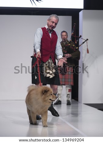 NEW YORK - APRIL 08: Geoff Day and dog walk runway at charity fashion show From Scotland With Love at Stage 48 on April 8, 2013 in New York City