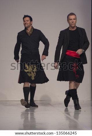 NEW YORK - APRIL 08: Scottish TV presenters Colin & Justin walk on runway at charity fashion show From Scotland With Love at Stage 48 on April 8, 2013 in New York City