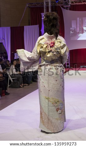 NEW YORK - APRIL 19: Model walks runway for Kimono Fashion Show NYC celebration of Japanese Culture at Grand Central Terminal Vanberbilt Hall on April 19, 2013 in New York City